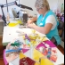 Изготовление развивающих игрушек. Швея Елена, помимо сборки изделий стажирует швей-инвалидов.